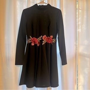 Mini black dress with flower detailing
